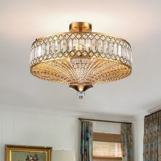 a chandelier hanging from the ceiling in a living room