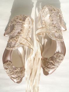 two pairs of wedding shoes with lace on them