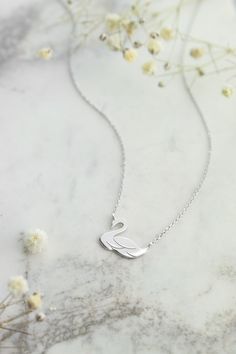 "WE ARE ON VACATION! Our workshop will be closed from the 6th until the 30th of August. Don't miss our \"while we are away\" special discount! \"The most beautiful bird for the most beautiful woman! A solid gold swan necklace is the ideal gift for you or someone you love. Dainty and elegant, just like you!\" --Fairy Goldcharm ♥♥ CUSTOMIZATION ---> Available in yellow, white, and rose gold. ♥♥ DETAILS The charm is 1.28cm x 1cm. (approx. 0.5in x 0.4in) ♥♥ CHAIN ---> The necklace is presented White Gold Wedding Necklace With Hallmark, Elegant Hallmark Necklace For Mother's Day, Elegant Hallmarked Necklaces For Mother's Day, Formal White Gold Necklace With Hallmark, Necklace For Wedding, Gold Swan, Swan Necklace, Necklace White Gold, Beautiful Swan