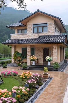 a house with flowers in the front yard