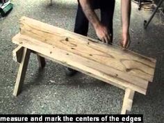 a man is bending over a bench made out of wooden planks and plywood