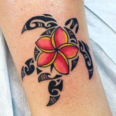 a tattoo on the leg of a woman with a flower in the middle of it