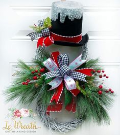 a christmas wreath with a top hat on it