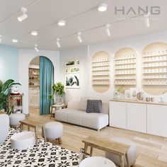 the interior of a nail salon with white furniture and mirrors on the wall above them