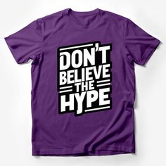 Make a statement with this eye-catching 'Don't Believe The Hype' T-shirt. This bold graphic shirt is not just a piece of clothing, but a form of self-expression. Perfect for those who like to stand out from the crowd, it features a snappy slogan that's sure to start conversations. Ideal for casual outings, this unisex tee fits comfortably and looks great with jeans or shorts. Made from quality materials, it ensures durability and comfort. Whether you're treating yourself or looking for a unique Purple Crew Neck Top With Letter Print, Purple Letter Print Crew Neck Top, Trendy Purple Slogan T-shirt, Purple Crew Neck Top With Text Print, Purple Short Sleeve T-shirt With Text Print, Purple Graphic Crew Neck Top, Purple Crew Neck T-shirt With Text Print, Purple Cotton T-shirt With Letter Print, Casual Purple Slogan T-shirt