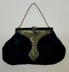 Antique Womens Handbag Item listed for sale is a pretty antique women's purse/handbag. The purse is made of faux suede and contains a clip as its fastener. Good vintage condition with a little wear. 6 3/4'' Wide, 4 1/2'' Height Hangs 8 1/4'' approximates Thank you for looking! Retro Evening Pouch Bag, Retro Pouch Bag For Party, Retro Party Pouch Bag, Vintage Evening Shoulder Bag With Hasp Closure, Vintage Shoulder Bag With Gold-tone Hardware For Party, Vintage Bags With Gold-tone Hardware, Vintage Evening Bag With Gold-tone Hardware, Vintage Brown Bag With Gold-tone Hardware, Womens Purses