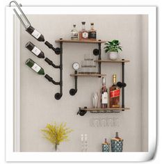 a wall mounted shelf with wine bottles and glasses on it next to a potted plant