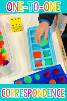 a child is playing with some sort of colored balls in an ice tray and the words, one - to - one correspondence