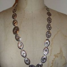 Great Stamping Detail On This One Of A Kind Concho Necklace. Circa 1940's. Each Small Concho Measures 1 1/4" By 3/4" Wide. Necklace Measures 28" Long. Acid Tested For Sterling Silver. Closes With An Invisible Hook On The Underside Of The Large Concho And Hole In Smaller Concho. Elegant Silver Jewelry For Western-themed Events, Artisan Silver Necklace With Concho, Vintage Long Necklace, One Of A Kind Oval Vintage Necklace, Silver Artisan Necklace With Concho, Western Style Engraved Silver Necklace, Bohemian Sterling Silver Necklace With Concho, Western Style Silver Engraved Necklace, Handmade Vintage Necklace For Western-themed Events