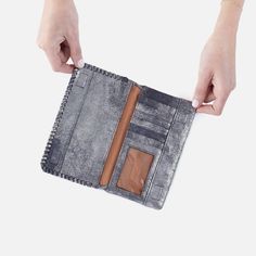 Style and function come together in this slim wallet with whipstitch detail. Foray Large Wallet In Metallic Leather  Blue Pewter LARGE WALLET in Blue | Hobo® Silver Clutch Wallet For Everyday Use, Silver Leather Wallets, Silver Wallet With Card Slots For Daily Use, Silver Bifold Wallet With Card Slots, Luxury Wallets With Silver-tone Hardware For Formal Occasions, Blue Leather Formal Wallets, Classic Blue Leather Wallets, Blue Leather Wallet With Removable Pouch, Luxury Leather Wallets With Silver-tone Hardware