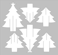 cut out paper christmas trees on a gray background