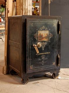 an old metal box sitting on the ground