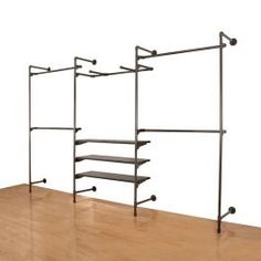 an empty shelf with three shelves on each side and two wheels attached to the wall