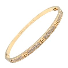 About This Piece: Discover the epitome of elegance with this Authentic Cartier 18k Yellow Gold Love Bangle. Symbolic screw motifs punctuate the warm, romantic hue of the bracelet, interlaced with brilliant-cut pave diamonds for captivating sparkle.... Trinity Bracelet, Love Bangle, Yellow Gold Bangle, Diamond Bangles Bracelet, Fine Jewelry Bracelets, Gold Bangle Bracelet, Diamond Bangle, Love Bracelets, Buying Jewelry