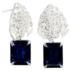 This contemporary Peony Petal spring floral dangle stud earrings are in 18 karat white gold with 62 round natural diamonds, VS, F-G, and sapphire, octagon cut, 4,5 carats in total. The sculptural design adds the extra highlights to the surface of the gold. The diamonds add the delicate blinks. Flowers jewellery collection was featured in Vogue UA and Harper's Bazaar reviews. We use top natural diamonds VS, F-G, we work with gems company, that is in the market since 19th century. This piece can b Luxury Diamond Cut Octagon Earrings, Evening Sapphire Earrings With Diamond Accents, Evening Earrings With Sapphire And Diamond Accents, Sapphire Earrings With Diamond Accents For Evening, Brilliant Cut Sapphire Earrings In Silver, Silver Sapphire Earrings With Brilliant Cut, Brilliant Cut Sapphire Earrings For Evening, Evening Sapphire Earrings With Brilliant Cut, Sapphire Earrings With Brilliant Cut For Evening