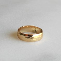 Thick Hammered Gold Band  Our thick hammered gold band ring is perfect for everyday! 14kt gold filled, this band is classic and timeless.  D E T A I L S -Hammered gold band - 5.5mm  -14kt gold filled  -snakeskin texture  D E T A I L S *Hammered gold band - 4mm *100% 14kt gold filled *Wear it plain or choose a special message for the inside CUSTOM HAND Engraving *Can be left blank or hand engraved *Inside is personalized in uppercase block letters or numbers *One character can be a heart or & sig Gold Hammered Wide Band Ring, 14k Gold Hammered Wide Band Ring, Adjustable Yellow Gold Wide Band Ring For Anniversary, Elegant 14k Gold Hammered Wide Band Ring, Everyday Hammered Thick Band Jewelry, Anniversary Hammered Wide Band Ring, Adjustable Wide Band 14k Gold Promise Ring, Adjustable 14k Gold Wide Band Promise Ring, Hammered Thick Band Wide Ring For Promise