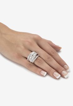 a woman's hand with a diamond ring on it