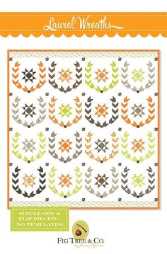 an orange and white quilt with leaves on it, in the shape of arrows is shown