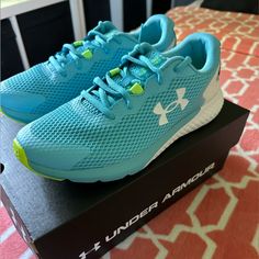 Under Armor Girls Ggs Charged Rogue 3 Tennis Shoes. Never Worn, In Original Packaging. Bright Blue With Lime Green And White Accents. Light Blue Running Shoes With Round Toe, Blue Under Armour Running Sneakers, Under Armor Shoes, Under Armour Blue Running Sneakers, Armor Shoes, Under Armour Shoes, White Accents, Under Armor, Green And White