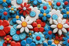 decorated cookies are arranged in the shape of flowers