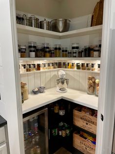 an open pantry with lots of food in it