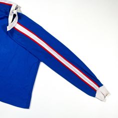 This is a vintage 1970s Nike Sportswear tshirt, it is in excellent condition and labeled as a size medium. Sporty Cotton Tops With Striped Sleeves, Blue Sporty T-shirt With Contrast Stripes, Casual Striped Tops For Sports Events, Blue Sportswear Top With Three Stripes Branding, Blue Sportswear Top With Three Stripes, Sporty Streetwear Tops With Contrast Stripes, Sporty Long Sleeve Tops With Striped Sleeves, Blue Athleisure Tops With Three Stripes, Varsity Adidas Top For Streetwear