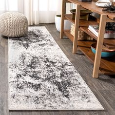 a white and black rug in a living room