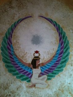 an image of a woman with wings on her head sitting in the middle of a circle