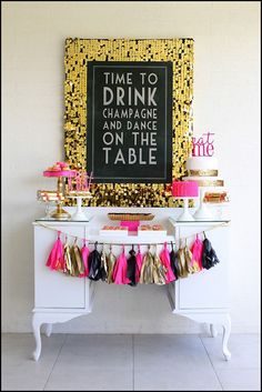 a table topped with cake and desserts next to a chalkboard that says time to drink champagne and dance on the table