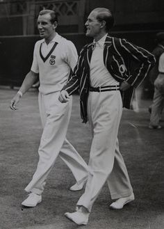 two tennis players are walking on the court