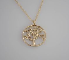 A symbol of growth, strength and positive energy, this beautiful 14K gold Tree of Life Pendant and chain are truly inspiring. A great gift for a friend or your source of inspiration. The necklace will be shipped in a beautiful gift box. ★ Tree of life pendant is 14K yellow gold, it is 22mm. ★ Necklace is 14K yellow gold . Please choose 1.5mm flat cable chain (delicate ) or 1.3mm Double rope chain. Please read our policies before you place your order. https://www.etsy.com/shop/SashJewelry/policy? Sterling Silver Yellow Gold Tree Of Life Necklace, Yellow Gold Sterling Silver Tree Of Life Necklace, Elegant Yellow Gold Tree Of Life Necklace, Elegant Yellow Gold Tree Of Life Jewelry, 14k Yellow Gold Tree Of Life Jewelry, Mother Daughter Necklaces Set, Gold Tree Of Life, Gift For Grandmother, Gold Heart Bracelet