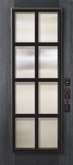 the front door is black and has glass panels on each side, along with a metal handle