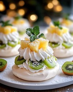 small desserts with kiwi slices and whipped cream