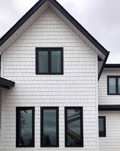 a white house with black trim and windows