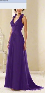 a woman in a purple dress posing for the camera