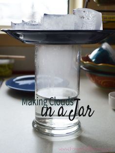 ice cubes in a glass on top of a table with the words making clouds as far as you can see