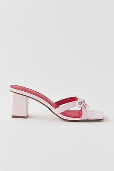 UO Charlie bow mule heel. Sweet little heels from UO. Strappy upper with bow detailing set on a modern block heel. Features UO Charlie bow mule heels Strappy heeled sandals Bow accent Slip-on style Content + Care PU, polyester. rubber Wipe clean Imported | Urban Outfitters UO Charlie Bow Mule Heel in Pink/Red, Women's at Urban Outfitters Church Shoes, Heels With Bows, Homecoming 2024, Hoco Inspo, Coquette Clothing, Church's Shoes, Mule Heel, Rush Outfits, Senior Stuff