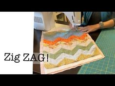 a woman is using a sewing machine to sew on a piece of fabric with the words zig zag in front of her