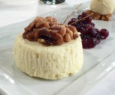 three desserts on a white plate with cranberry sauce and pecanse