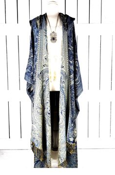 Hooded maxi blue tribal pashmina kimono cover up jacket with custom length and fringe detail Measurements...taken flat - width across seam to seam: 46"  -length in photo: 48" - maxi length is as selected with or without fringe Features... - lovely soft woven medium weigh pashmina fabric -attached hood and optional fringe -custom length - bohemian oversized flowing design - cardigan style with an open front and generous arm holes  - universal design allows a comfortable fit for small through plus sizes - the perfect layering piece that can easily be dressed up or down - wrinkle resistant  - handmade with love by me in California Shop the jewelry here... https://www.etsy.com/shop/ThreeFeathersStudio?ref=seller-platform-mcnav&section_id=26806370 Oversized Bohemian Shawl For Spring, Bohemian Fringe Outerwear For Summer, Long Bohemian Outerwear With Tassels, Bohemian Long Outerwear With Tassels, Bohemian Summer Outerwear With Tassels, Bohemian Fringe Kimono For Fall, Bohemian Tassel Kimono For Fall, Bohemian Fall Kimono With Tassels, Fall Bohemian Fringe Kimono