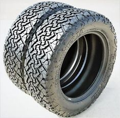 three tires are stacked on top of each other in the middle of a white background