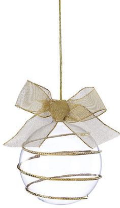 a glass ornament with a bow hanging from it