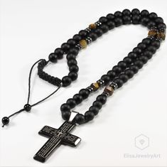 Cross Necklace Men's Natural Tiger Eye Black Onyx Beaded Protection Long Adjustable Healing Gemstone Macrame Necklace Gift For Him Unisex -ALL THE PRODUCTS AT ELISAJEWELRYART ARE HANDMADE AND MADE WITH NATURAL BEADS. -WHAT DOES THE ONYX STAND FOR A powerful protection stone, Black Onyx absorbs and transforms negative energy, and helps to prevent the drain of personal energy. Black Onyx aids the development of emotional and physical strength and stamina, especially when support is needed during t Adjustable Cross Necklace With 108 Beads, Adjustable Cross Necklace With 8mm Beads, Black Beaded Cross Necklace, Adjustable Cross Necklace With Black Beads, Adjustable Black Beads Cross Necklace, Spiritual Black Cross Beaded Necklace, Spiritual Onyx Bead Necklace, Spiritual Black Onyx Necklaces, Onyx Black Beaded Necklace For Meditation