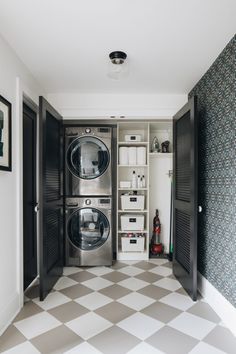 a washer and dryer sitting in a room next to each other on top of a checkered floor