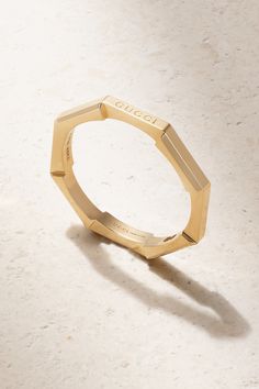 Gucci's 'Link to Love' ring is perfect for stacking alongside other styles in the collection. Made in Italy from 18-karat gold, it has a slim octagonal band that mimics a mechanical bolt and is engraved with the brand's moniker on one edge. Gucci Fine Jewelry Yellow Gold Rings, Gucci Yellow Gold Fine Jewelry Rings, Modern Gucci Yellow Gold Jewelry, Gucci Designer Rings In 14k Gold, Gucci 14k Gold Designer Rings, Designer Gucci 14k Gold Rings, Elegant Gucci Yellow Gold Rings, Luxury Gucci 14k Gold Rings, Gucci 14k Gold Rings