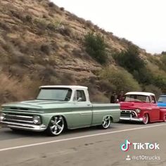 a man leaning on the hood of an old truck