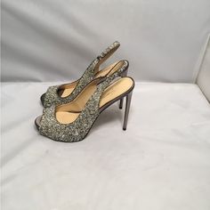 Not Your Typical Shoes. Party Up. This Is Parv- Glamour Glitter Silver And Gold Intertwined In A Beautiful Grey Sateen Sling Back Platform Heel Shoes . Shoes Are New No Box Store Display But, No Flaws. Heels Measurements Approximately 5” The Shoes It’s A Show Stopper. Silver Open Toe Party Heels, Glamorous Sparkling Heels For Gala, Sparkling Glamorous Heels For Party Season, Glamorous Sparkling Heels For Cocktail, Metallic Silver Round Toe Heels For Party, Holiday Party Slingback Heels, Evening Open Toe Sequined Heels, Party Heels With Sequins, Glamorous Glitter Heels