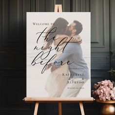 an easel with a wedding photo on it