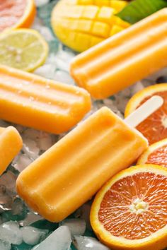 popsicles with oranges and lemon slices on ice