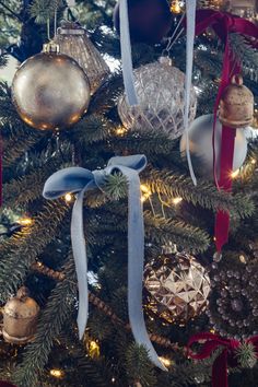 a christmas tree with ornaments hanging from it